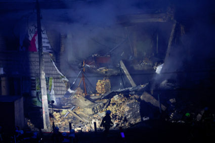 Rescuers work at a site of a Russian missile strike, in Kyiv