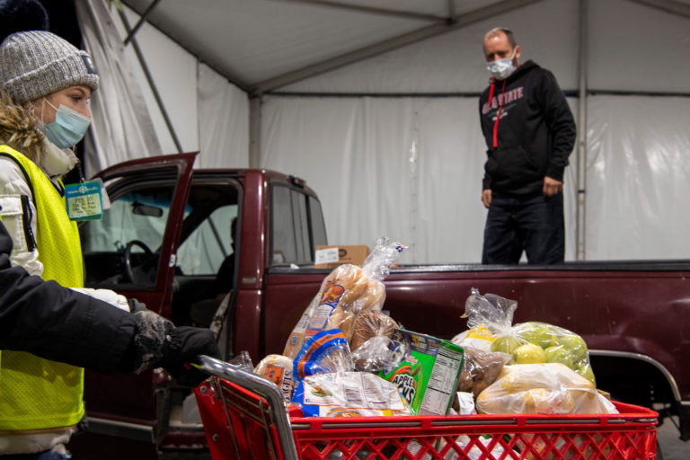 People receive donations at a food bank in Ohio