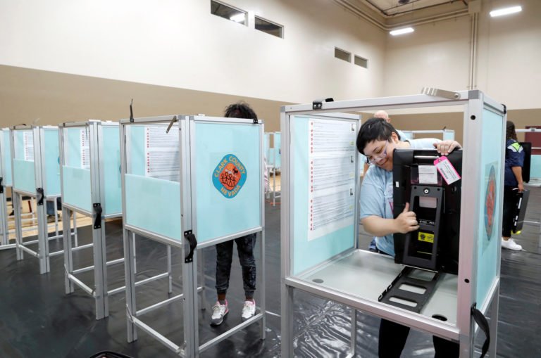 Clark County election department workers set up an early voting polling site in Las Vegas