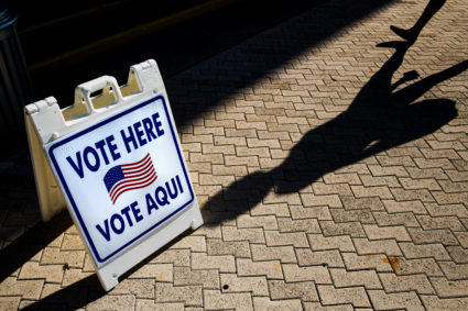 A "Vote Here" sign outside a polling location in Miami. Photo by Scott McIntyre/Bloomberg