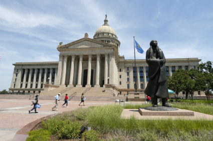 The statue "As Long as the Waters Flow" stands outside the Oklahoma State Capitol. Artist Allan C. Houser, a member of the Chiricahua Apache tribe, said the statue is a tribute to Native Americans and references their plight during Indian removal. Photo by Nate Billings
