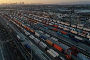 An aerial view of shipping containers and freight railway trains ahead of a possible strike if there is no deal with the rail worker unions, at the Union Pacific Los Angeles (UPLA) Intermodal Facility rail yard in Commerce, California, U.S., September 15, 2022. Photo by Bing Guan/REUTERS