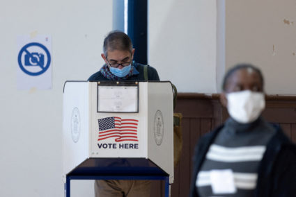 FILE PHOTO: Voters cast their ballots at a polling station during early voting in New York City