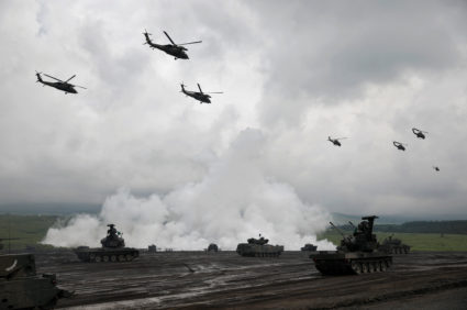 As regional threats rise, Japan shifts away from defense-only strategy