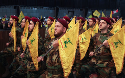 Members of Lebanon's Hezbollah hold flags during a rally commemorating the annual Hezbollah Martyrs' Day in Beirut's southern suburbs, Lebanon November 11, 2022. Photo by Aziz Taher/REUTERS