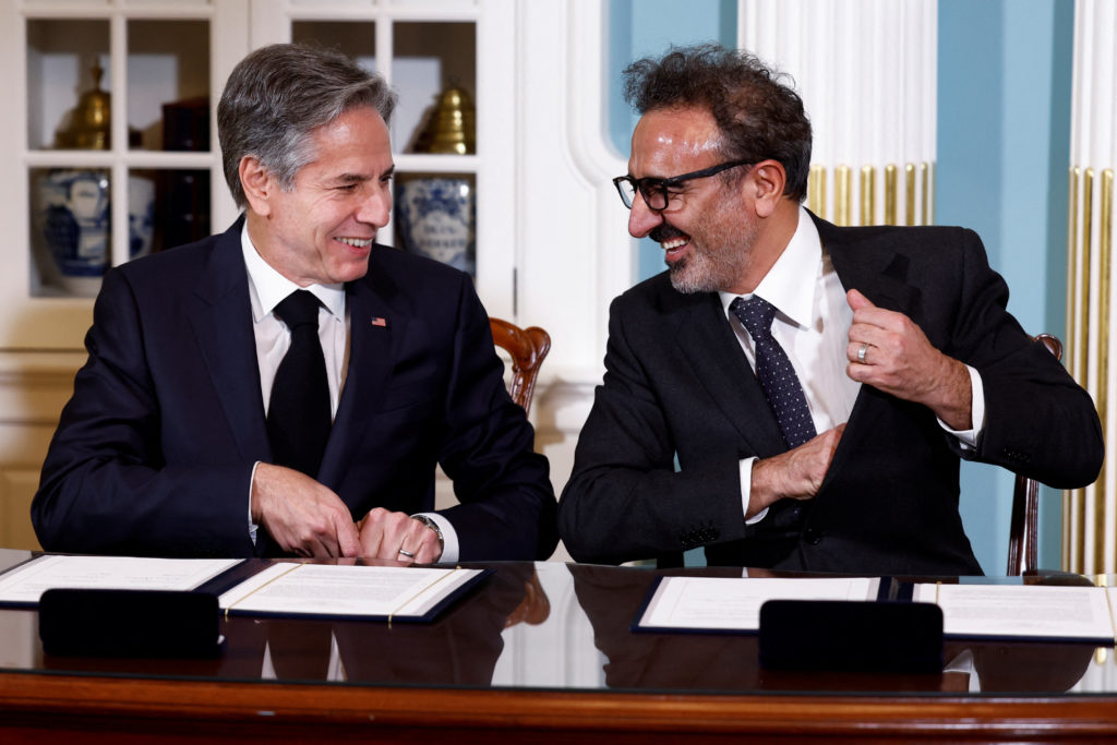 U.S. Secretary of State Antony Blinken and CEO of Chobani and Tent founder Hamdi Ulukaya participate in a Memorandum of Understanding (MOU) signing ceremony at the State Department in Washington, U.S., December 12, 2022. Photo by Evelyn Hockstein/Pool/REUTERS