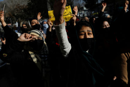 Afghan women chant slogans in protest against the closure of universities to women by the Taliban in Kabul