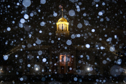 Snow falls during a winter storm warning at the Old Capitol Building in Iowa City
