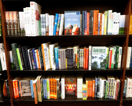 Climate change themed books are displayed together on shelves at a Barnes &amp; Noble book store in Brooklyn, New York