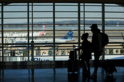 Passengers walk in the terminal at Ronald Reagan Washington National Airport as a budding winter storm across the much of the country is likely to cause travel delays ahead of the Christmas holiday, in Arlington, Virginia, U.S., December 20, 2022. Photo by Kevin Lamarque/REUTERS