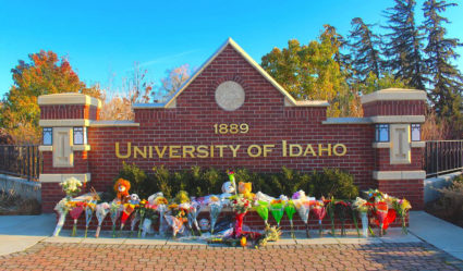 Flowers, notes and stuffed animals sit along the University of Idaho&apos;s entrance sign on Pullman Road in Moscow to honor the four students stabbed to death in an off-campus home on Nov. 13. Photo by Angela Palermo/The Idaho Statesman/Tribune News Service via Getty Images