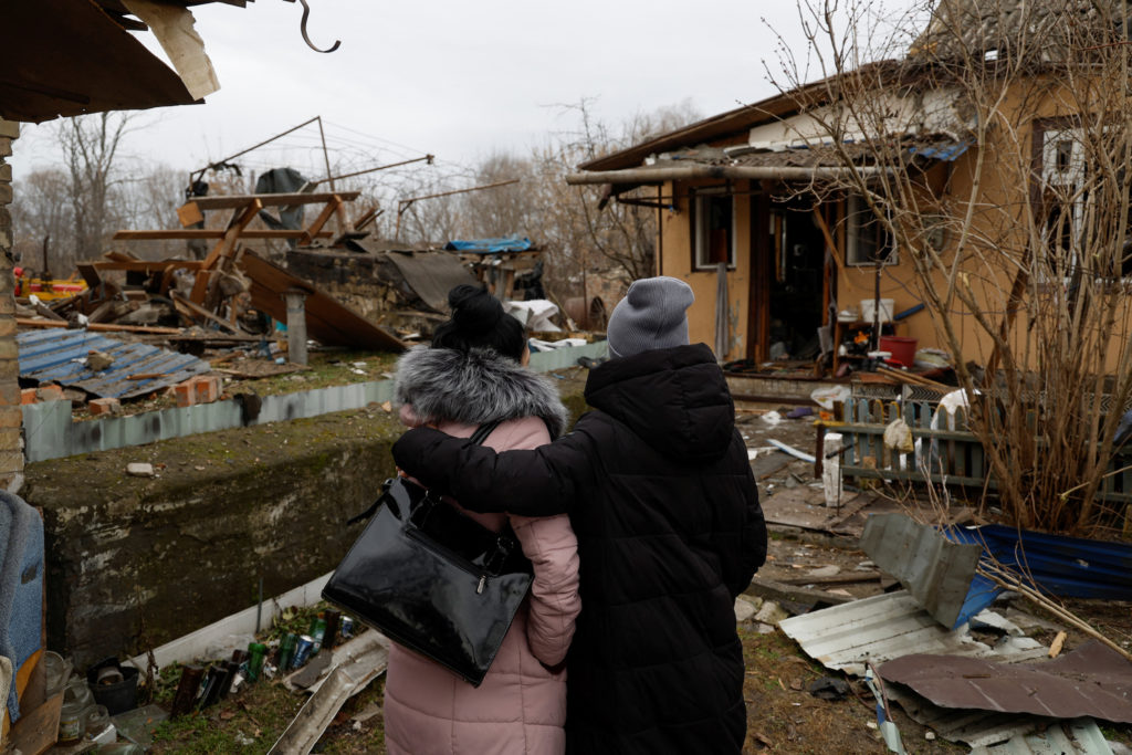 Local residents resident react after Russian missile strike, in Kyiv