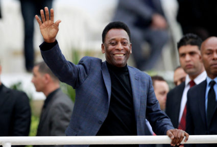 FILE PHOTO: Brazilian soccer legend Pele waves during the international friendly soccer match between Algeria and Slovenia...