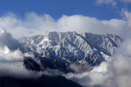 Snow and low clouds are seen on the San Jacinto Mountains in Palm Springs