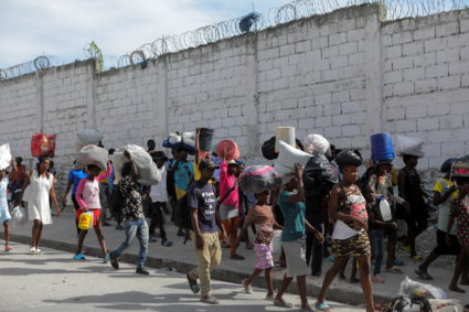 People displaced by gang war violence in Cite Soleil walk on the streets of Delmas neighborhood after leaving Hugo Chaves square in Port-au-Prince, Haiti November 19, 2022. Photo by Ralph Tedy Erol/REUTERS