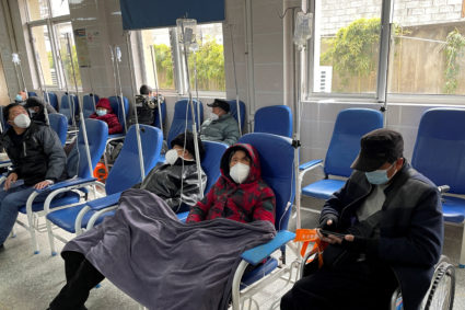Patients receive IV drip treatment at a hospital, amid the coronavirus disease (COVID-19) outbreak, at a village in Tonglu...