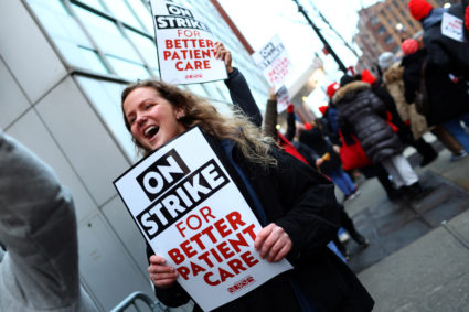 Striking union nurses from the New York State Nurses Association (NYSNA) walk picket line in Bronx New York