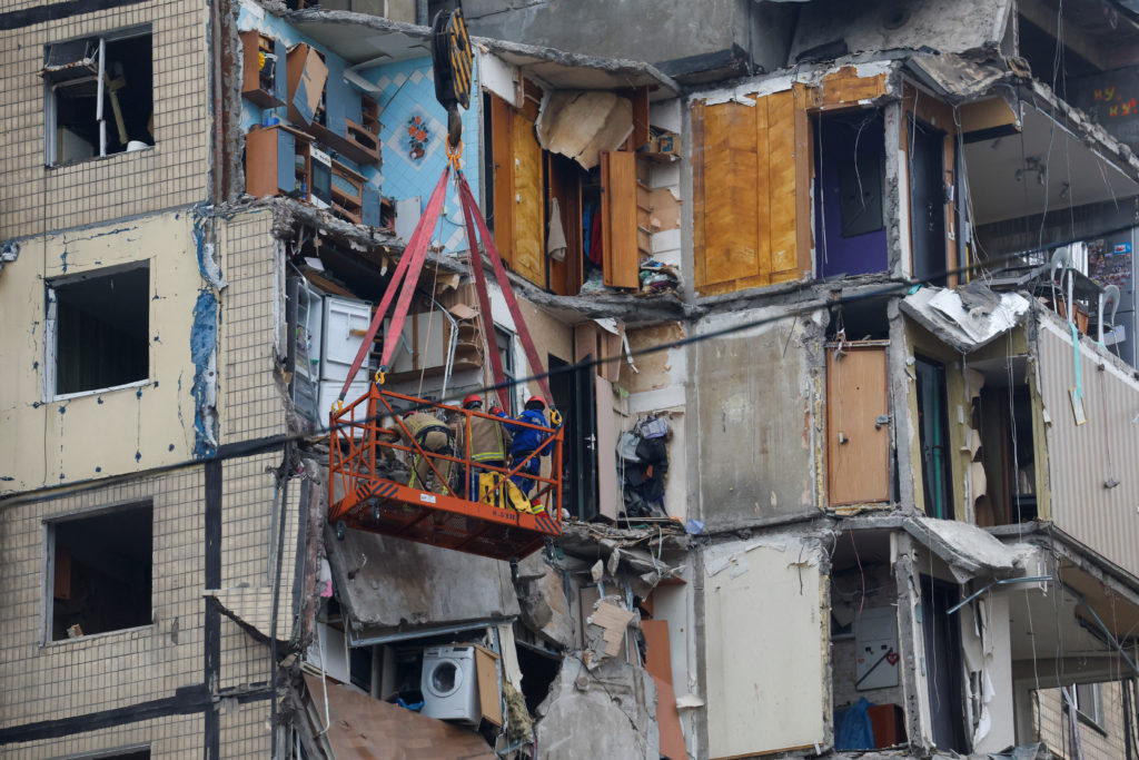 Aftermath of Dnipro apartment block destruction following missile strike
