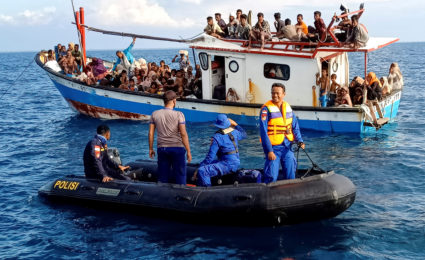 FILE PHOTO: FILE PHOTO: Rohingya refugees are seen on a boat near the coast of Seunuddon beach in North Aceh