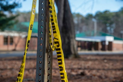 Police tape hangs from a sign post outside Richneck Elementary School following a shooting on Jan. 7, 2023, in Newport News, Virginia. Photo by Jay Paul/Getty Images
