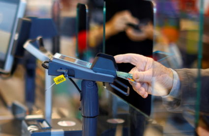Customers shop in a Lidl supermarket near Nice