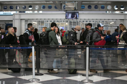 Passengers wait for the resumption of flights at O'Hare International Airport