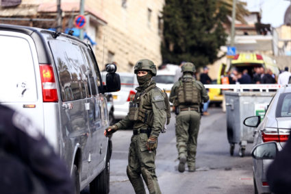 Israeli security personnel work near a scene where a suspected incident of shooting attack took place, police spokesman sa...