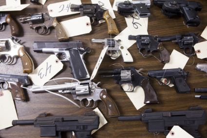San Diego law enforcement officials show weapons collected during a gun buy-back in San Diego.