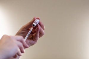 People receive their second COVID-19 boosters in Waterford, Michigan
