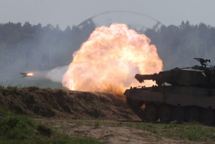 FILE PHOTO: Polish Leopard 2PL tank fires during Defender Europe 2022 military exercise at the military range in Bemowo Pi...