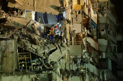 Aftermath of Dnipro apartment block destruction following missile strike