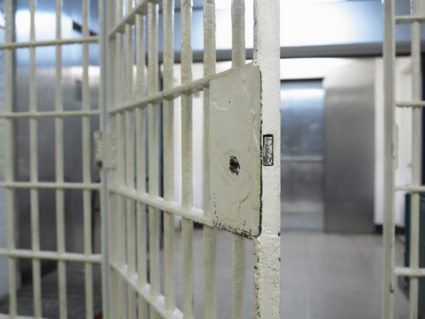 Open door to prison cell in Queens House of Detention, New York. Photo provided by Getty Images