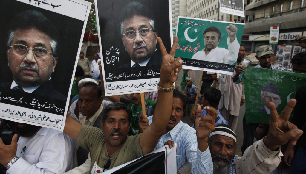 Supporters of former President Pervez Musharraf chant slogans during a protest in Karachi