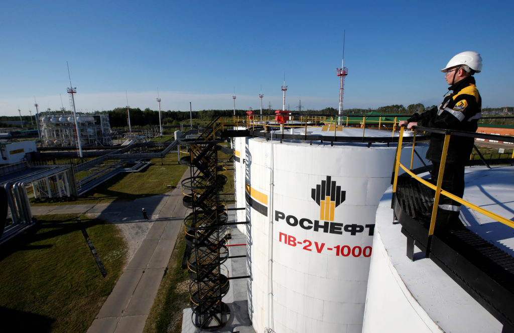 FILE PHOTO: A worker is seen at the central processing facility of the Rosneft-owned Priobskoye oil field outside the West...