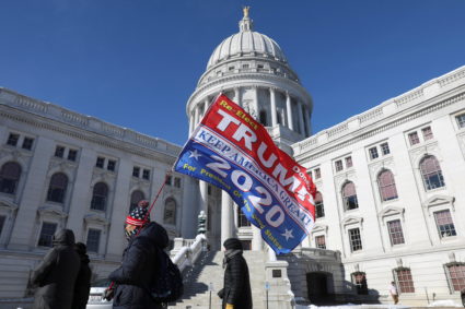 Protestors recite Catholic prayers as they walk outside as Wisconsin electors gather to cast their votes for the U.S. presidential election at the Wisconsin State Capitol in Madison, Wisconsin, U.S., December 14, 2020. Photo by Daniel Acker/REUTERS