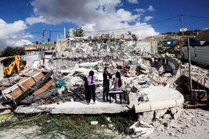 Palestinian children play on the remains of their home after it was demolished by Israeli forces in Jabal Mukaber in East ...