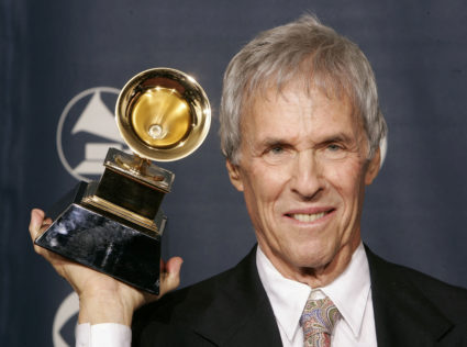 FILE PHOTO: Composer Burt Bacharach poses with the Grammy award he won for best pop instrumental album for 'At T..