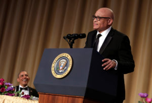 President Barack Obama listens to comedian Larry Wilmore at the White House Correspondents' Association annual dinner