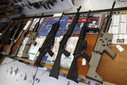 Guns for sale are displayed in Roseburg Gun Shop in Roseburg