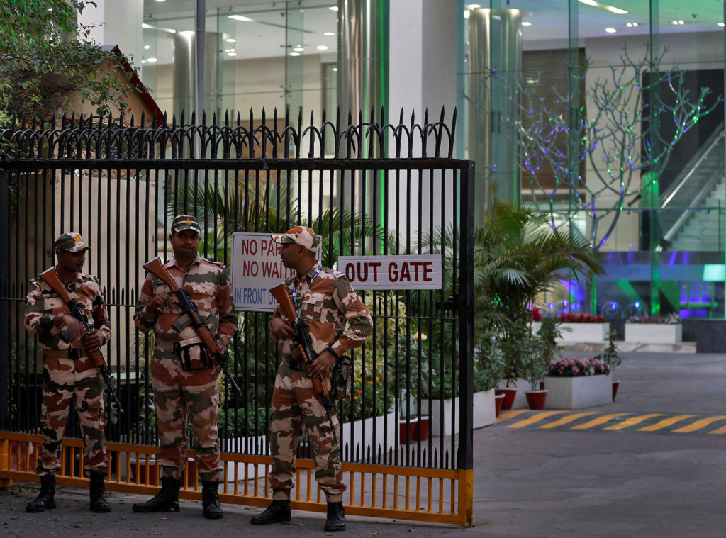 Members of the Indo-Tibetan Border Police stand guard outside a building housing BBC offices, in New Delhi