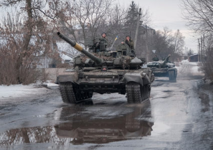 Ukrainian service members ride tanks in Bakhmut