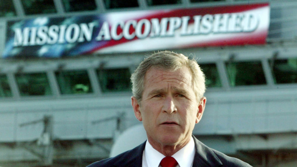 George W. Bush delivering a speech to crew aboard the aircraft carrier USS Abraham Lincoln, as the carrier steamed toward San Diego, California on May 1, 2003. Photo by Larry Downing/FILE KL/GN/GAC/REUTERS