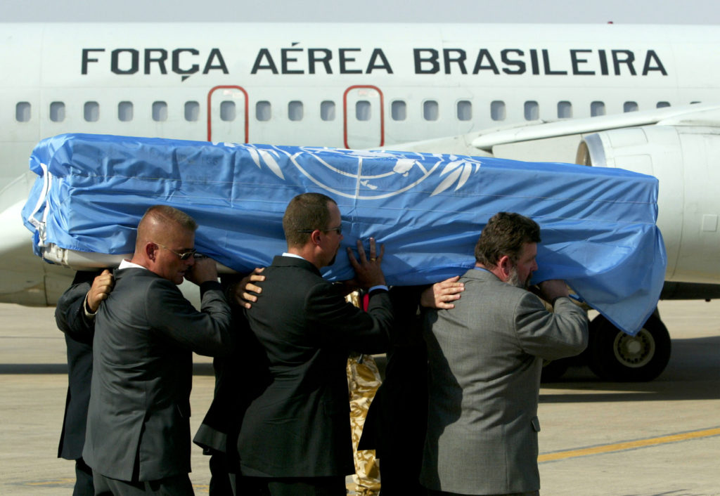 A coffin containing the body of the U.N.special envoy to Iraq, Sergio Vieira de Mello, is carried by U.N. workers to a Brazilian plane at the airport in Baghdad, August 22, 2003. Sergio Vieira de Mello, who was killed in a bomb attack in Baghdad, will be brought back to his native Brazil for a ceremony before burial in France. Photo by Zohra Bensemra PA/JV/REUTERS