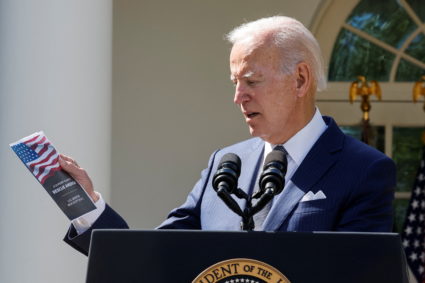 U.S. President Joe Biden holds U.S. Senator Rick Scott's (R-FL) "12-point plan to Rescue America," as he speaks at an event on health care costs, Medicare and Social Security, in the Rose Garden at the White House in Washington, U.S., September 27, 2022. Photo by Jonathan Ernst/REUTERS
