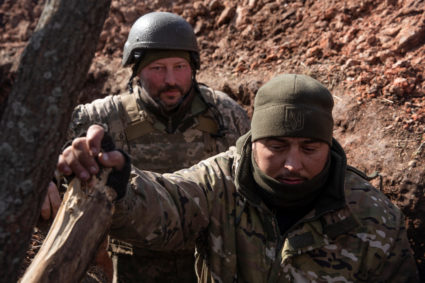 Ukrainian service members are seen inside a trench outside of the frontline town of Bakhmut