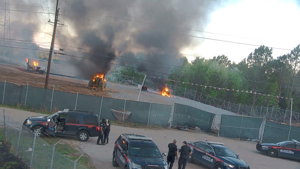 Protesters and police members clash at the construction site of an Atlanta police training center