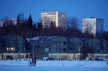 The ConocoPhillips Alaska Inc. building overlooks the frozen Westchester Lagoon on a winter's evening in downtown Anchorage, Alaska, U.S. Feb. 10, 2020. File photo by Yereth Rosen/Reuters