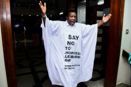 Member of Parliament from Bubulo contituency John Musira dressed in an anti gay gown gestures as he leaves the chambers during the debate of the Anti-Homosexuality bill, which proposes tough new penalties for same-sex relations during a sitting at the Parliament buildings in Kampala, Uganda March 21, 2023. Photo by Abubaker Lubowa/REUTERS