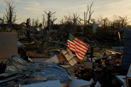 An American flag sits amidst the wreckage of a home after thunderstorms spawning high straight-line winds and tornadoes ripped across the state in Rolling Fork, Mississippi, U.S. March 27, 2023. Photo by Cheney Orr/REUTERS