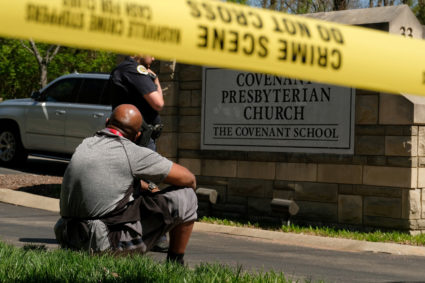 Mario Dennis, one of the kitchen staff at the Covenant School, sits after a shooting in Nashville